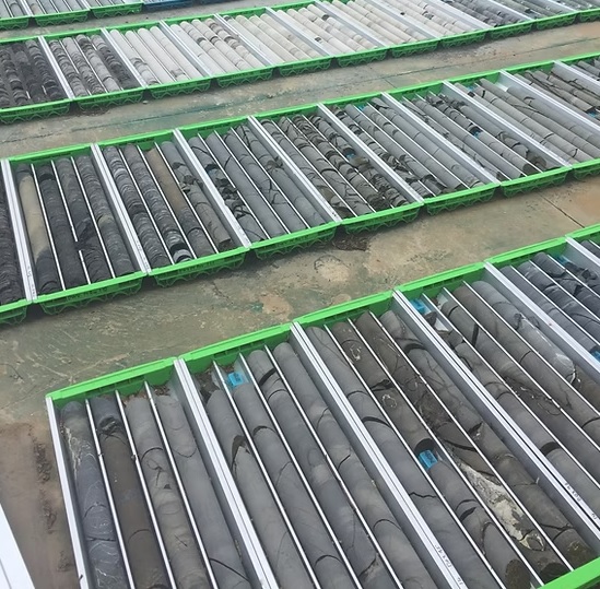 Rows of HQ size core trays awaiting logging on site.